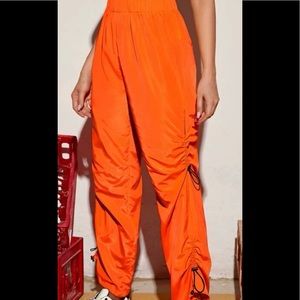 orange stacked windbreaker pants
